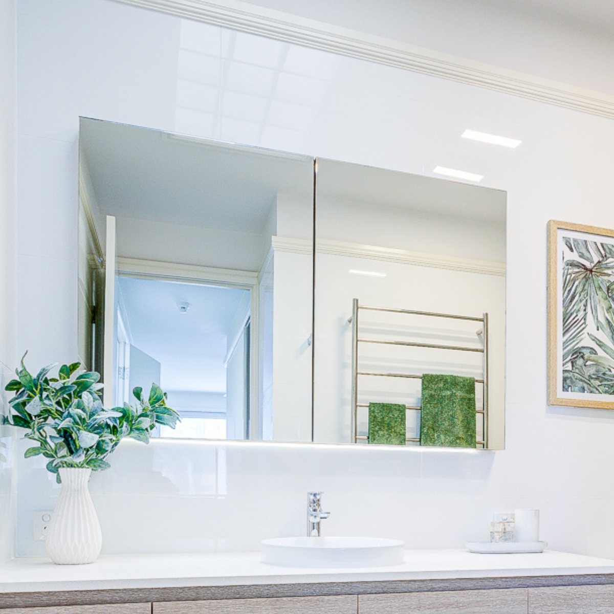 Posh Domaine mirrored shaving cabinet above a vanity